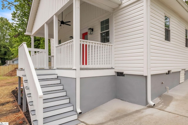 doorway to property featuring a porch and ceiling fan