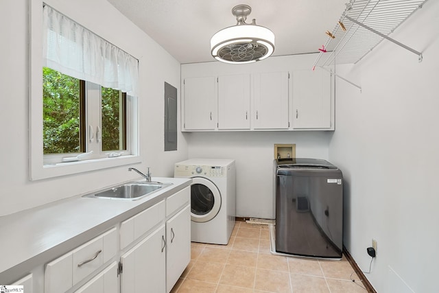 laundry room with cabinet space, washing machine and clothes dryer, and light tile patterned floors