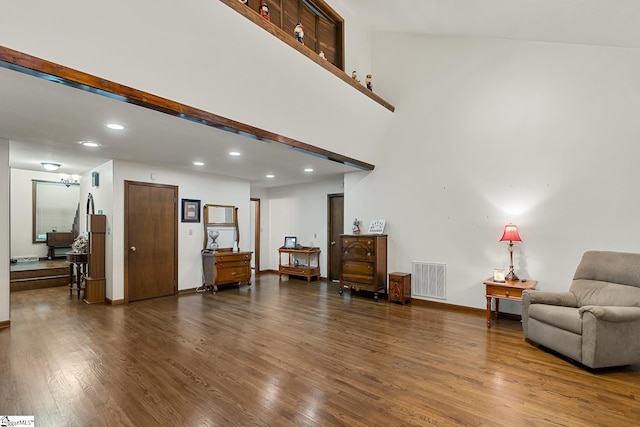 living area with recessed lighting, dark wood finished floors, and baseboards