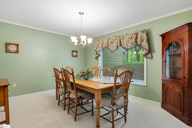 dining room featuring a chandelier, light colored carpet, crown molding, and baseboards