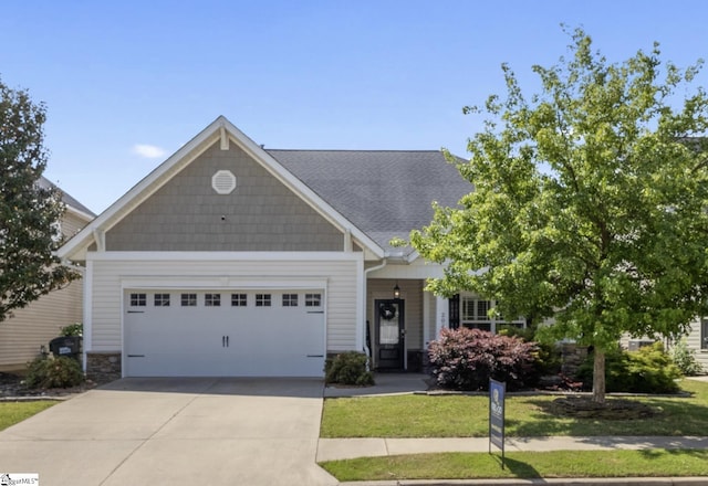 208 Medoc Ln, Moore, SC 29369 - craftsman-style home featuring driveway, an attached garage, a shingled roof, and stone siding