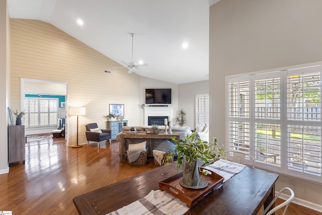 208 Medoc Ln, Moore, SC 29369 - living area with high vaulted ceiling, wood finished floors, plenty of natural light, a fireplace, and wood walls