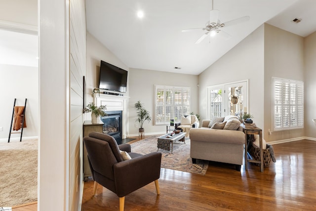 208 Medoc Ln, Moore, SC 29369 - living area with high vaulted ceiling, a fireplace with flush hearth, baseboards, ceiling fan, and wood finished floors