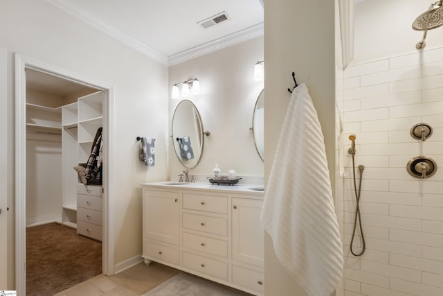 208 Medoc Ln, Moore, SC 29369 - bathroom featuring double vanity, a tile shower, ornamental molding, and a walk in closet