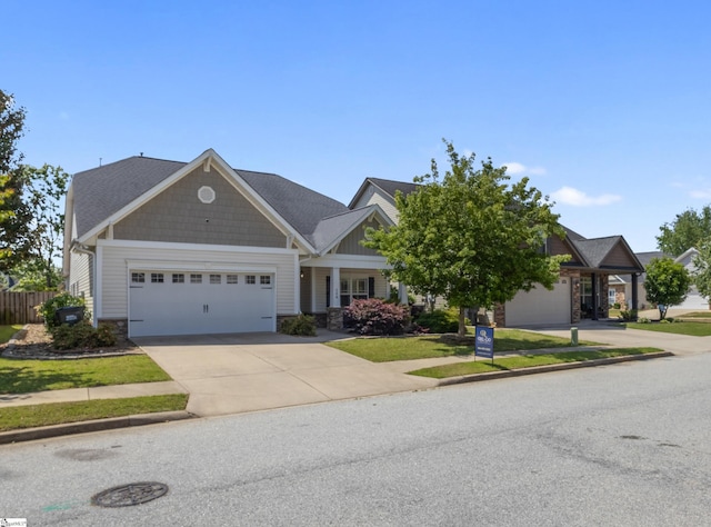 208 Medoc Ln, Moore, SC 29369 - craftsman-style house featuring stone siding, driveway, and an attached garage