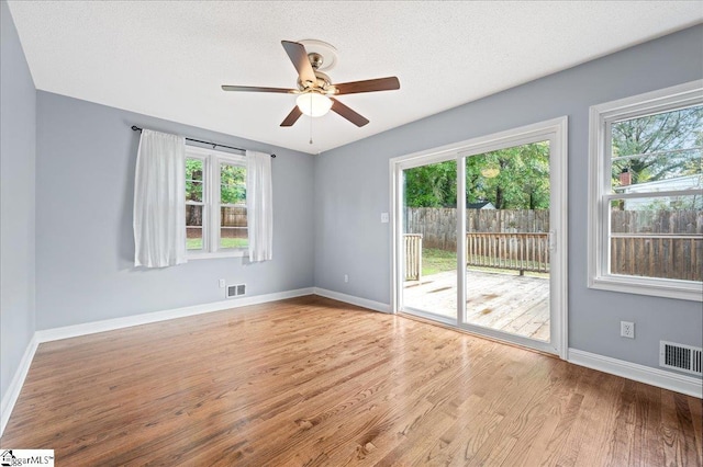 222 Woodview Ave, Spartanburg, SC 29306 - spare room with healthy amount of natural light, ceiling fan, wood finished floors, and baseboards