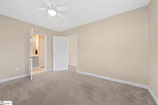 222 Woodview Ave, Spartanburg, SC 29306 - unfurnished bedroom featuring light colored carpet, baseboards, and connected bathroom