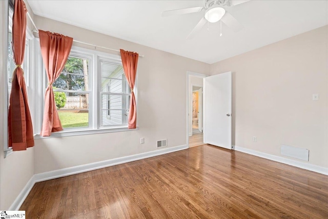 222 Woodview Ave, Spartanburg, SC 29306 - empty room featuring wood finished floors, baseboards, and a ceiling fan