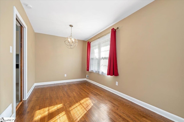 222 Woodview Ave, Spartanburg, SC 29306 - unfurnished room with dark wood-style floors, a chandelier, and baseboards