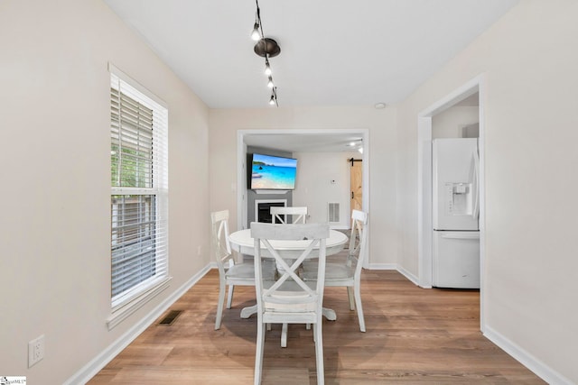 330 Split Oak Ln, Inman, SC 29349 - dining room featuring baseboards, light wood-style floors, and track lighting
