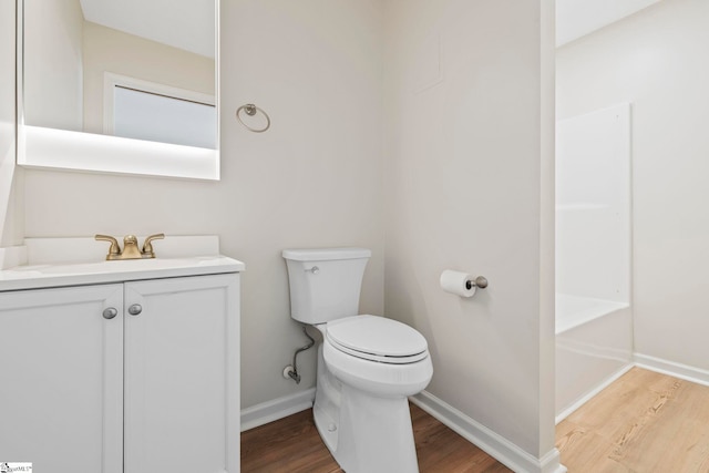 330 Split Oak Ln, Inman, SC 29349 - bathroom with wood finished floors, toilet, vanity, baseboards, and a bath