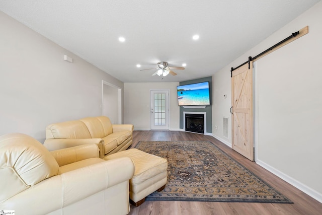 330 Split Oak Ln, Inman, SC 29349 - living room with a ceiling fan, a barn door, wood finished floors, recessed lighting, and baseboards