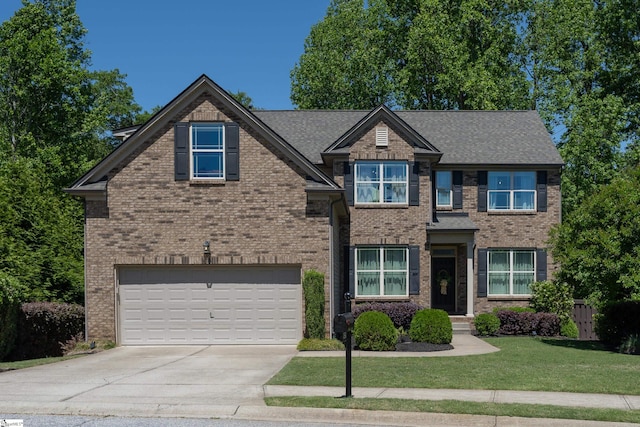 craftsman-style home with a garage, concrete driveway, and brick siding