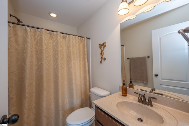 full bath with toilet and vanity