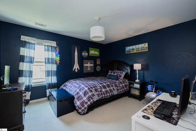 bedroom with carpet flooring and baseboards