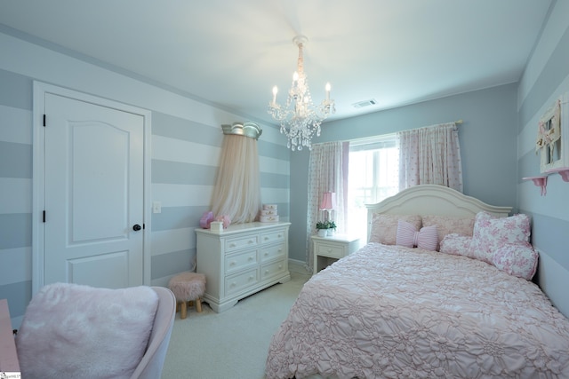 bedroom featuring a chandelier and light carpet
