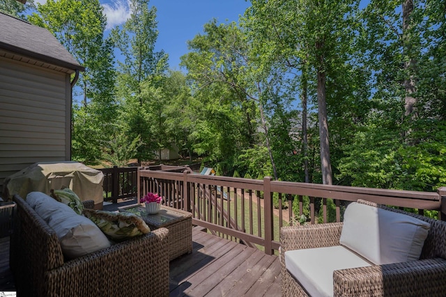 deck featuring view of scattered trees