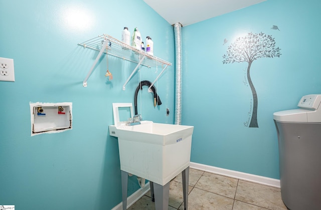 washroom featuring hookup for a washing machine and baseboards