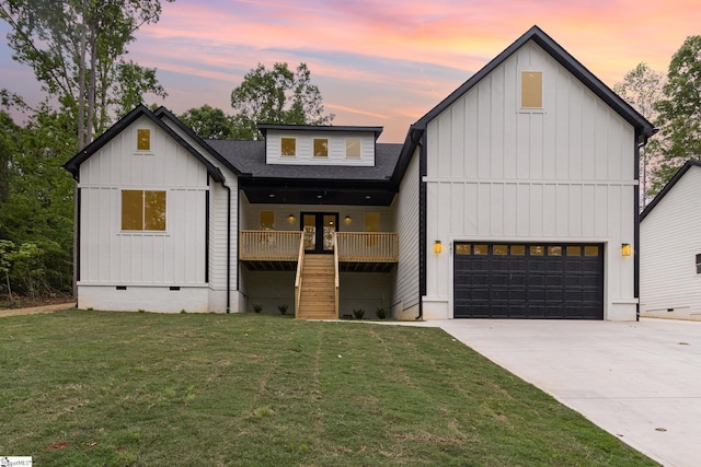 modern inspired farmhouse with board and batten siding, crawl space, a front yard, concrete driveway, and roof with shingles