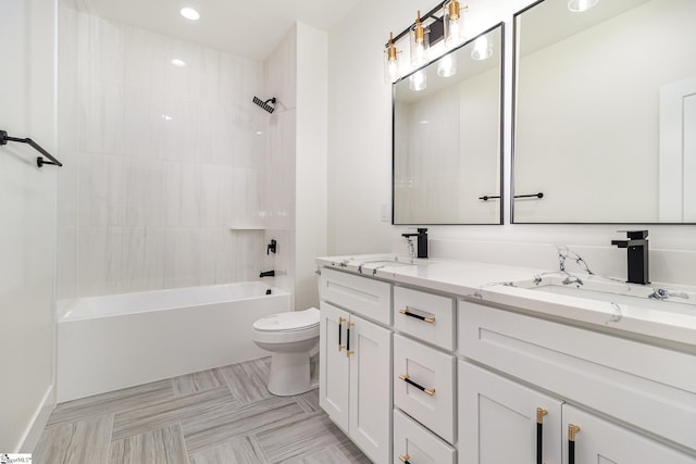full bath with toilet, double vanity, shower / bath combination, and recessed lighting