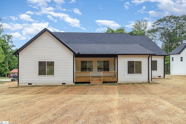 back of property featuring crawl space, covered porch, and a shingled roof