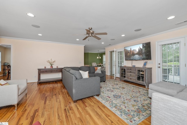 426 Isaqueena Dr, Greer, SC 29651 - living room with crown molding, plenty of natural light, light wood finished floors, a ceiling fan, and recessed lighting