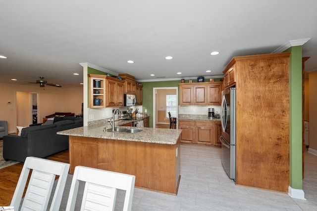 426 Isaqueena Dr, Greer, SC 29651 - kitchen featuring stainless steel appliances, a peninsula, a sink, open floor plan, and crown molding