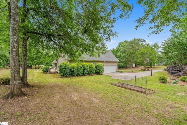 426 Isaqueena Dr, Greer, SC 29651 - view of grassy yard featuring concrete driveway and a garage