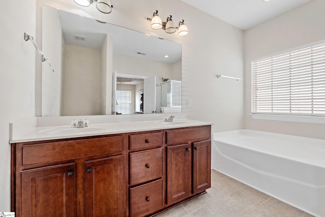 11 Penrith Ct, Simpsonville, SC 29681 - bathroom with plenty of natural light, a garden tub, and double vanity