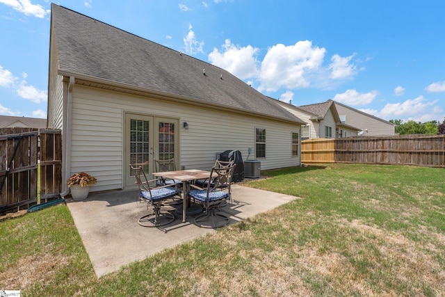 11 Penrith Ct, Simpsonville, SC 29681 - rear view of property featuring roof with shingles, a patio, central AC unit, and french doors