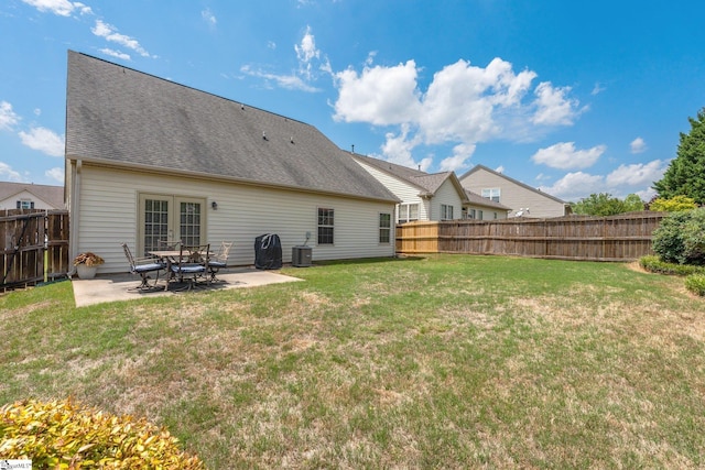 11 Penrith Ct, Simpsonville, SC 29681 - rear view of property with a patio area, central air condition unit, and roof with shingles