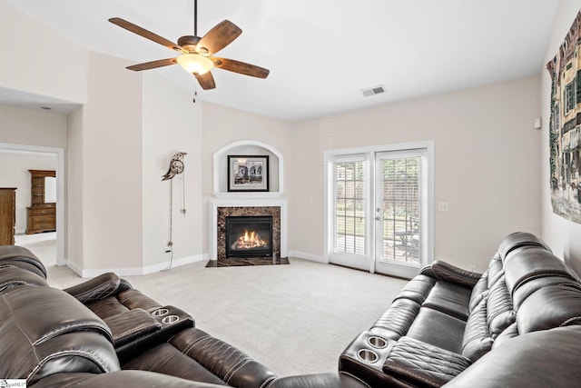 11 Penrith Ct, Simpsonville, SC 29681 - living room featuring light carpet, ceiling fan, a high end fireplace, baseboards, and lofted ceiling