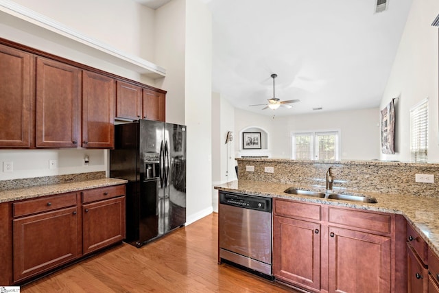 11 Penrith Ct, Simpsonville, SC 29681 - kitchen with black fridge with ice dispenser, dishwasher, a sink, light wood finished floors, and a ceiling fan