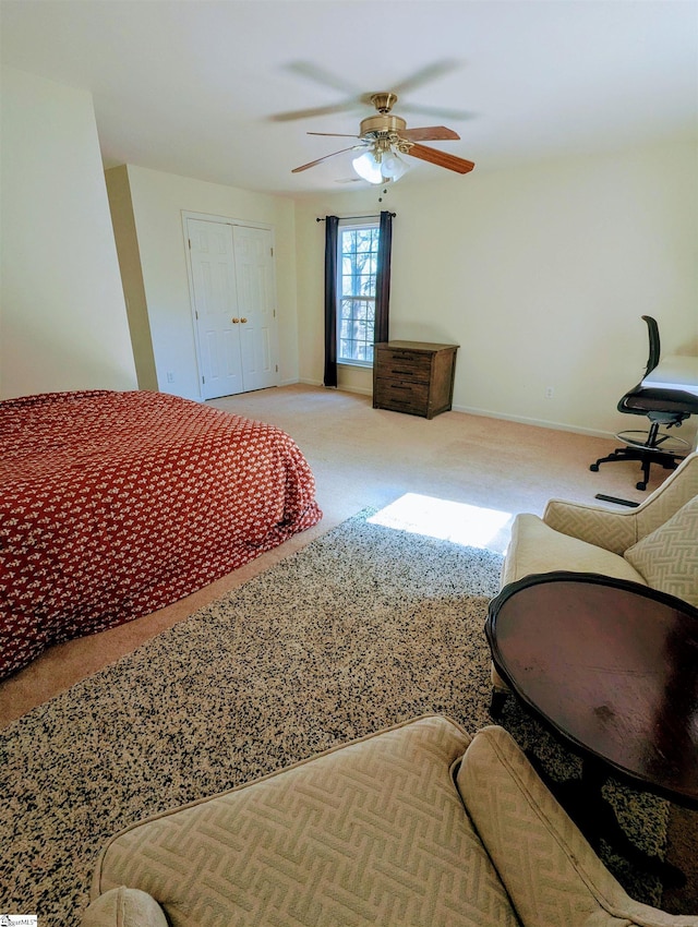 bedroom featuring carpet flooring, a ceiling fan, and baseboards