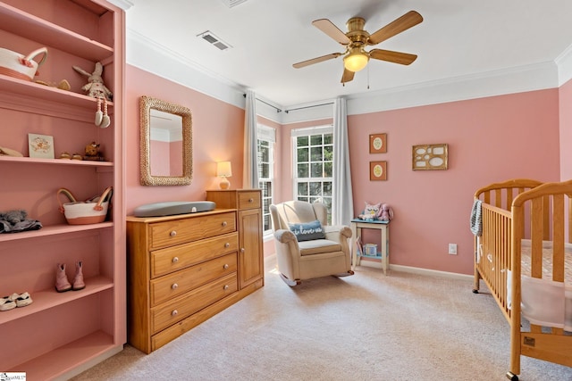 135 Bathurst Ln, Simpsonville, SC 29681 - bedroom with ornamental molding, a crib, light carpet, a ceiling fan, and baseboards