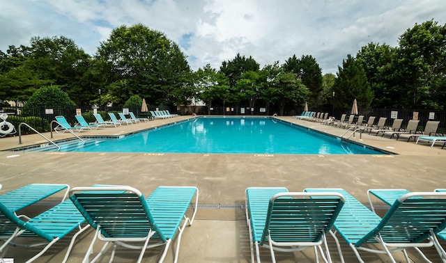 135 Bathurst Ln, Simpsonville, SC 29681 - community pool with a patio area and view of wooded area