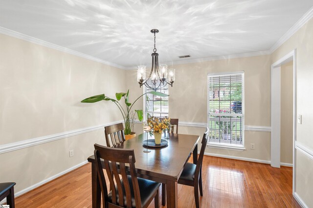 26 Willow Oak Ct, Simpsonville, SC 29681 - dining space featuring a chandelier, wood finished floors, baseboards, and ornamental molding