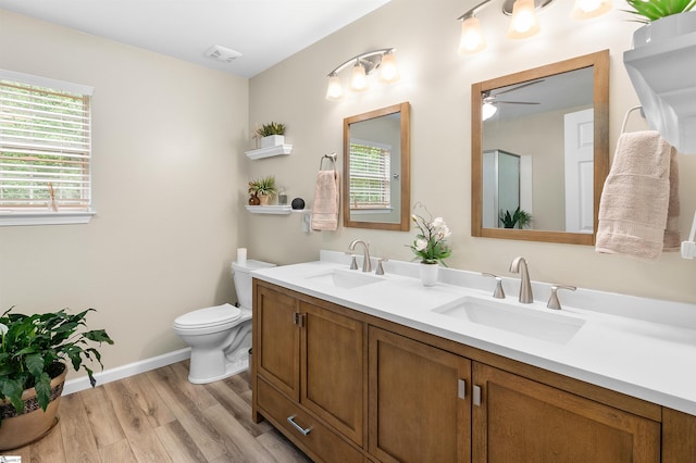 26 Willow Oak Ct, Simpsonville, SC 29681 - full bath featuring wood finished floors, toilet, ceiling fan, baseboards, and double vanity