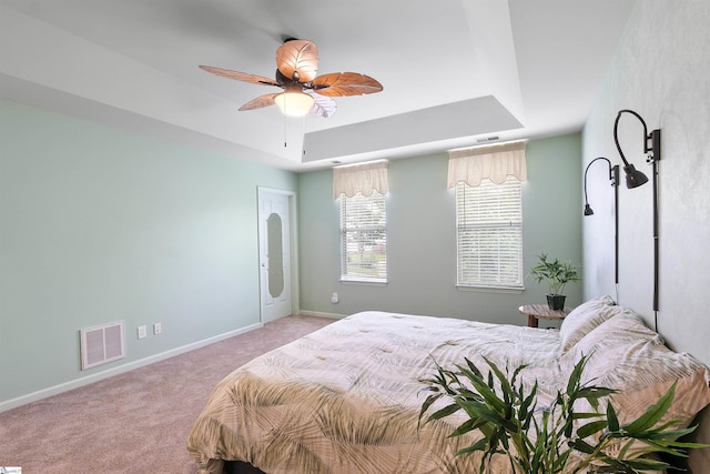 26 Willow Oak Ct, Simpsonville, SC 29681 - carpeted bedroom with baseboards, a ceiling fan, and a tray ceiling