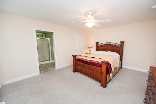 bedroom with light colored carpet, baseboards, connected bathroom, and ceiling fan
