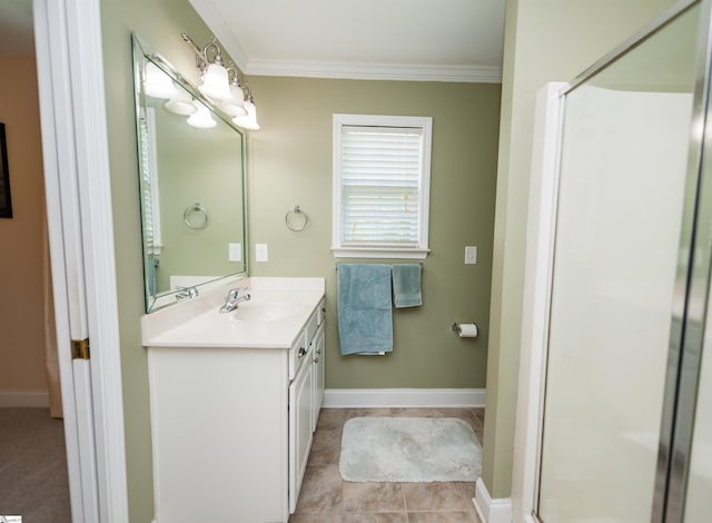 bathroom with a stall shower, ornamental molding, vanity, and baseboards