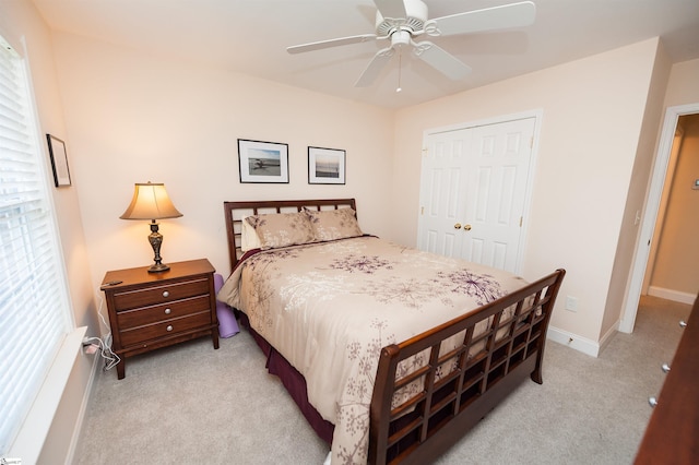 bedroom featuring carpet floors, a closet, ceiling fan, and baseboards