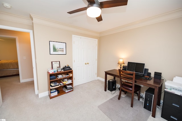carpeted office with a ceiling fan, ornamental molding, and baseboards