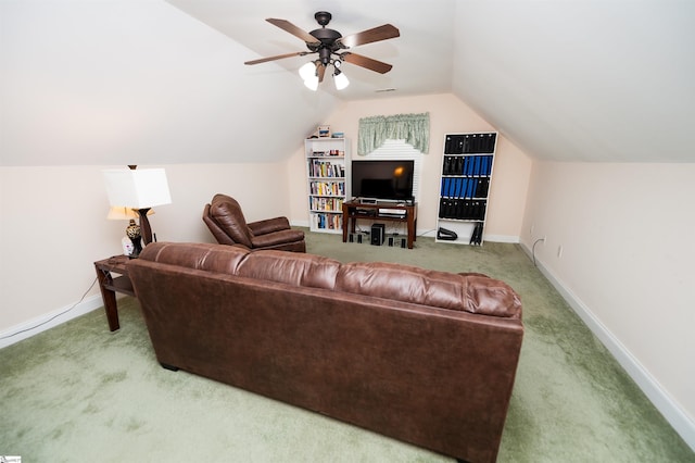 living room with carpet floors, vaulted ceiling, baseboards, and ceiling fan