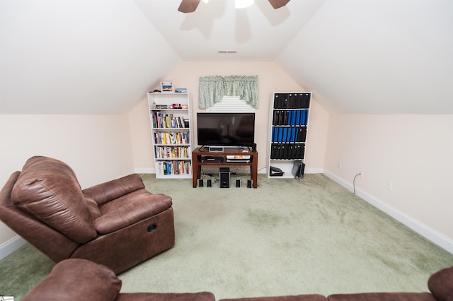 carpeted living room featuring a ceiling fan, lofted ceiling, and baseboards