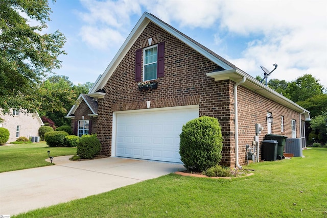 view of side of property with brick siding, a lawn, concrete driveway, and central AC unit