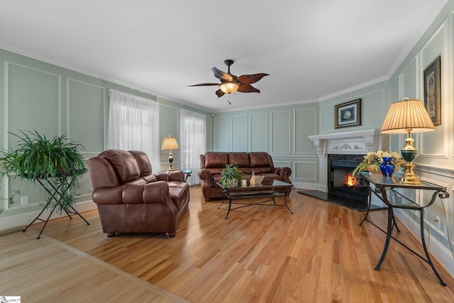 155 Mountain Lake Dr, Piedmont, SC 29673 - living area featuring a decorative wall, crown molding, a fireplace, light wood finished floors, and ceiling fan