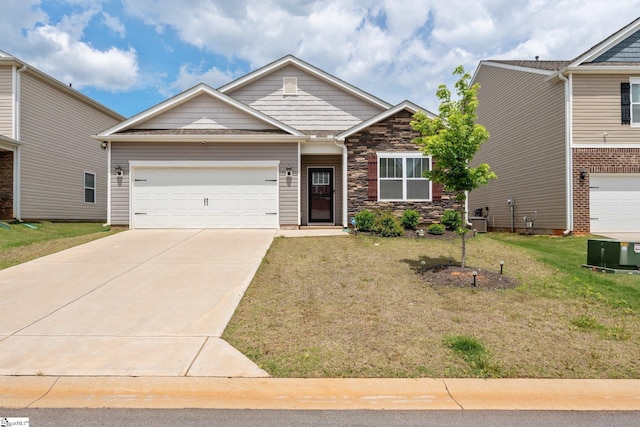 51 Oak Edge Ln, Greer, SC 29651 - craftsman-style house with stone siding, driveway, a garage, and a front lawn