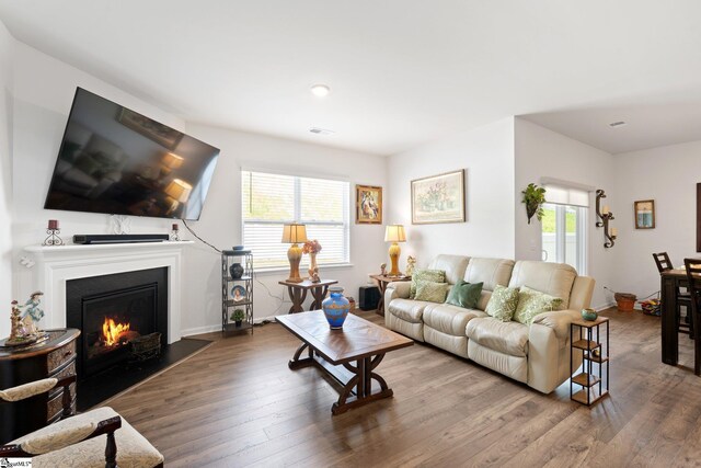 51 Oak Edge Ln, Greer, SC 29651 - living area with wood finished floors, a fireplace with flush hearth, and baseboards