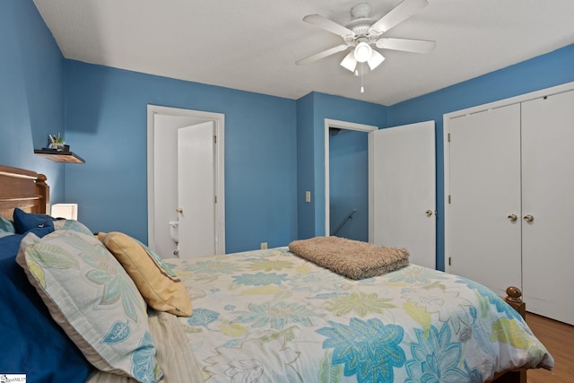 bedroom with a closet, wood finished floors, and a ceiling fan
